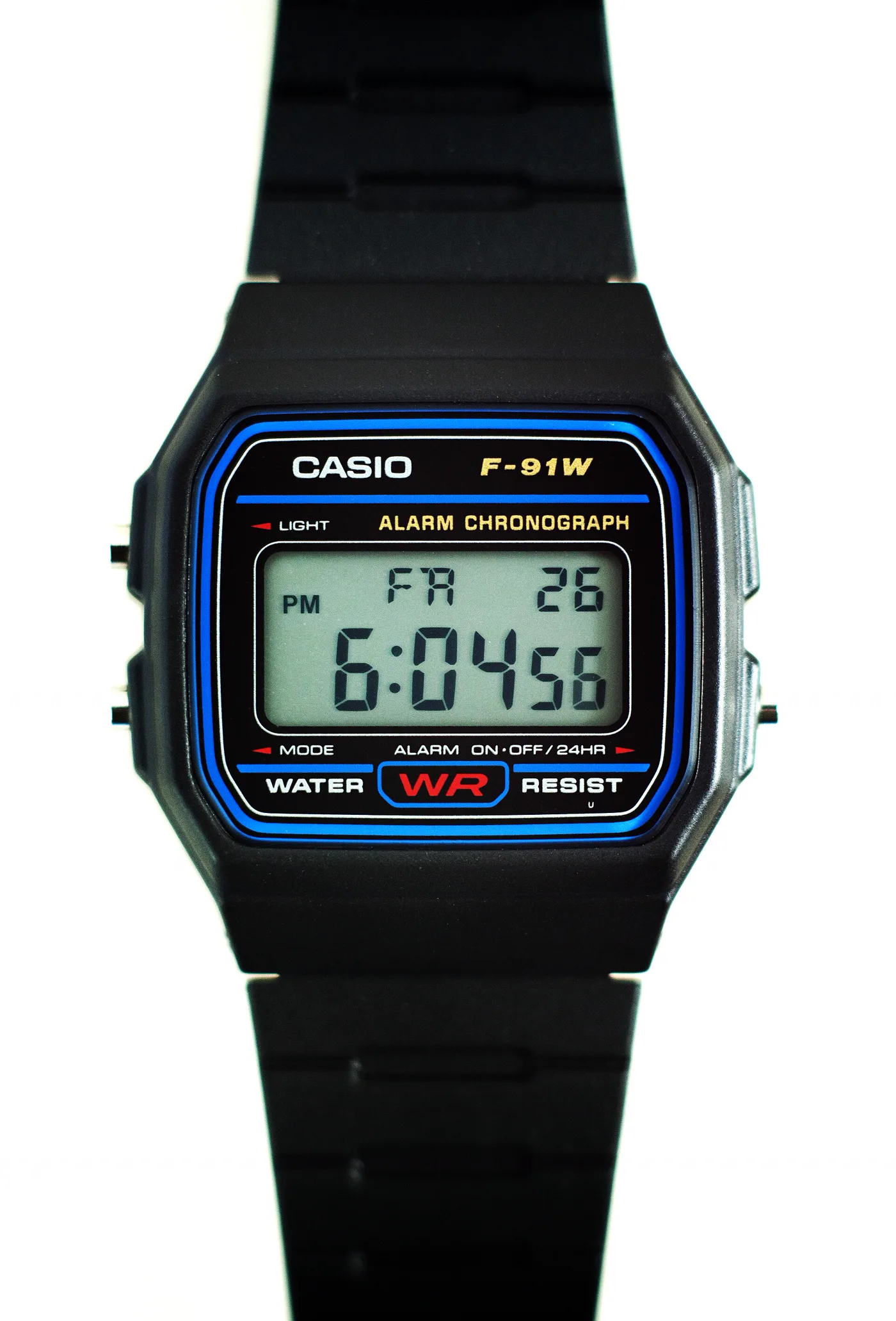 Casio F-91W black digital watch with resin strap, close-up studio product photo